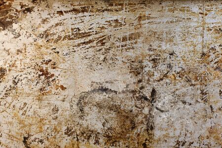 old grungy  coated metal baking tray with scratches and stains
