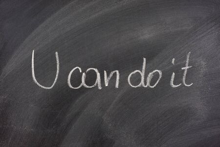 You can dot it phrase handwritten with white chalk on blackboardの写真素材