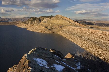 two rock dams of Horsetooth Reservoir and Centennial Road at foothills of Rocky Mountains in Colorado near Fort Collinsの写真素材