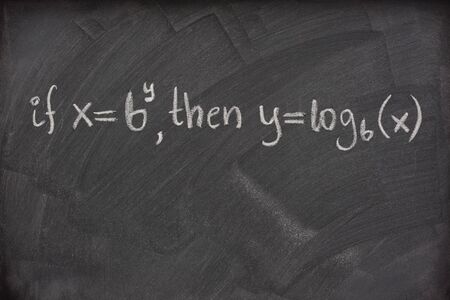 logarithm definition handwritten with white chalk on a school blackboard with eraser smudgesの写真素材