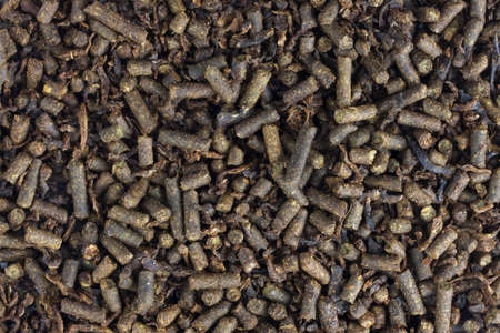 brown feed pellets for mature horses - background macro shot