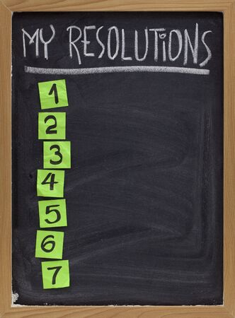 my resolutions - blank numbered list, white chalk handwriting and reminder notes on blackboardの写真素材