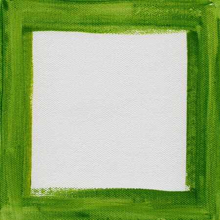 hand painted  green watercolor frame (border) surrounding white blank square on artist canvasの写真素材
