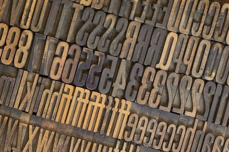 vintage well used wooden letterpress types, letters and numbers  (Gothic condensed), stained in inkの写真素材
