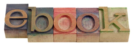 ebook (e-book) word - vintage wooden letterpress printing blocks stained by color inksの写真素材