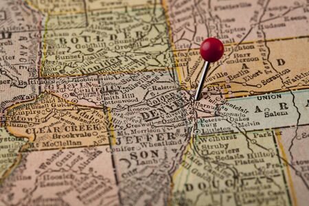 Denver on vintage 1920s map of Colorado with a red pushpin, selective focusの写真素材