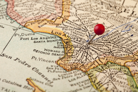 Los Angeles, California, vintage 1920s map (printed in 1926 - copyrights expired) with a red pushpin, selective focusの写真素材