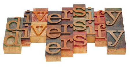 diversification concept - word abstract in vintage wooden letterpress blocks isolated on whiteの写真素材
