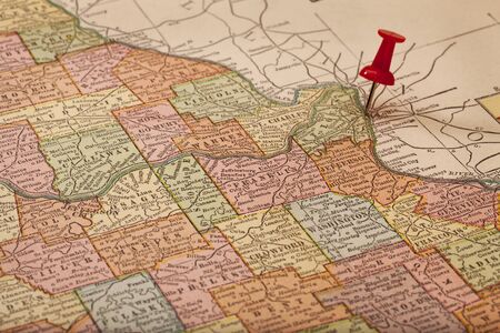 MIssissippi and Missouri Rivers on vintage 1920s map (printed in 1926 - copyrights expired) with a red pushpin on St Louis, selective focusの写真素材