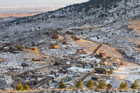 residential houses on slopes of Rocky Mountains near Fort Collins, Colorado, winter afternoon sceneryの写真素材