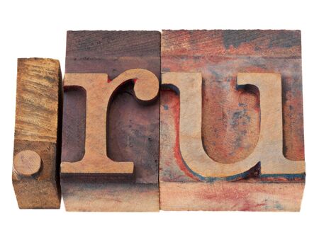 dot ru - internet domain for Russia in vintage wooden letterpress printing blocks, stained by color inks, isolated on whiteの写真素材