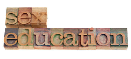 sex education headline in vintage wood letterpress printing blocks, isolated on whiteの写真素材