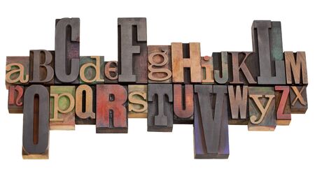 English alphabet abstract in antique wood letterpress printing blocks of different sizes and styles,...