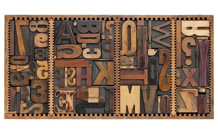 vintage letterpress printing blocks abstract with variety of  letters, numbers, punctuation signs in old boxの写真素材