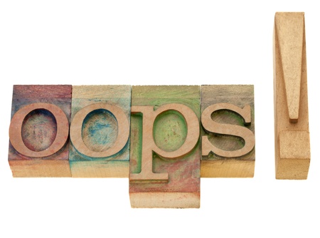 dismay or surprise cponcept - oops exclamation - isolated word in vintage wood letterpress printing blocksの写真素材