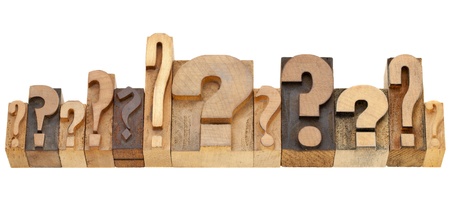 decision making concept - a row of question marks - vintage wood letterpress printing blocksの写真素材