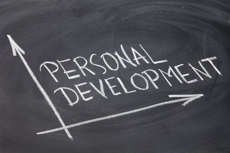 personal development concept - white chalk drawing on a blackboard