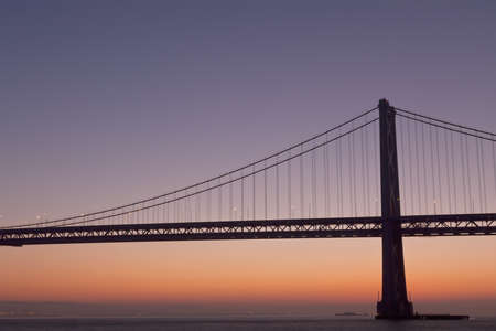 silhouette of suspension bridge detail at dawn (San Francisco Bay Bridge)の写真素材
