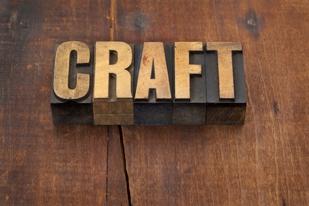 craft word in vintage letterpress wood type against grunge weathered wooden backgroundの写真素材