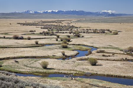 Illinois River meanders through Arapaho National Wildlife Refuge, North Park near Walden, Colorado,...