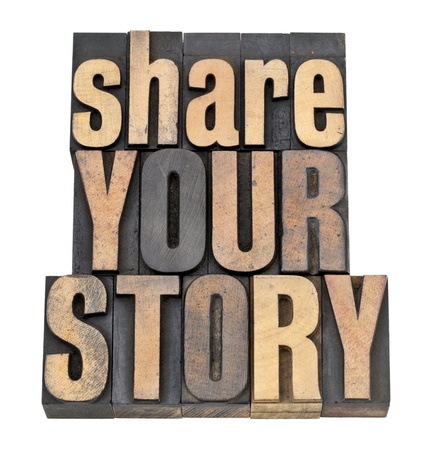 share your story phrase - isolated text in vintage letterpress wood typeの写真素材