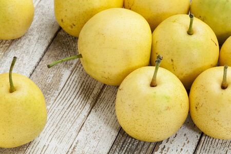 asian pears from home garden on grunge wood background