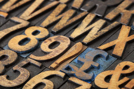 pound symbol among vintage letterpress  wood type blocks, selective focus