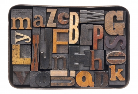 vintage letterpress wood type blocks with ink patina - all 26 letters of alphabet in an old metal...
