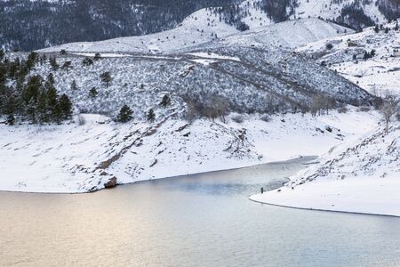 mountain lake at winter dusk - Horsetooth Reservoir near Fort Collins, Colorado, winter sceneryの写真素材