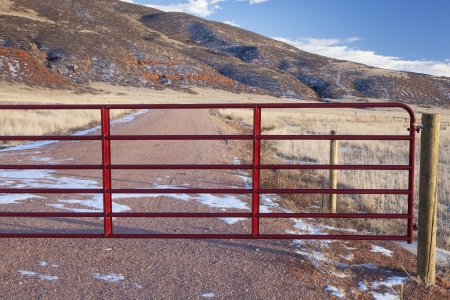 closet gate on a ranch road in a mountain valley - Red Mountain Open Space, Colorado