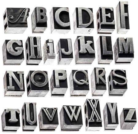 English alphabet - a collage of 26 isolated letters in grunge letterpress metal type block, a variety of fontsの写真素材