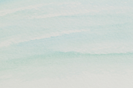 watercolor paper texture with delicate pastel blue wavesの写真素材
