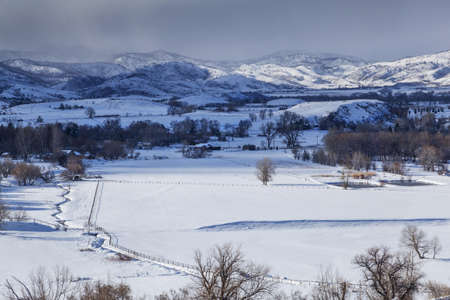 winter storm casting a shadow on a valley in Rocky Mountains - Pleasant Valley, Belvue near Fort COllins, COloradoの写真素材