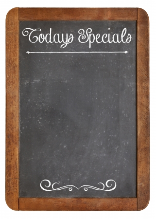 Today Specials - white chalk menu sign on a vintage slate blackboard isolated on whiteの写真素材