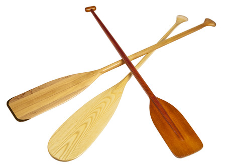 three wooden canoe paddles isolated on white with clipping paths