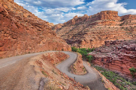 windy road in Canyonlands near Moab, Utah, descending into a canyon