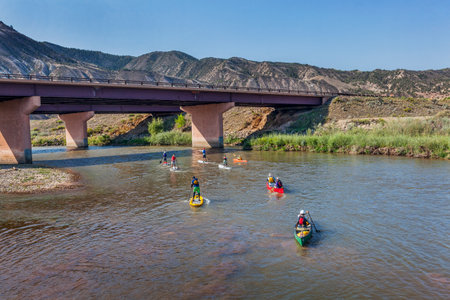 DOTSERO, CO - AUGUST 19: Stand up paddleboards, kayaks and canoes in the annual Colorado River Race in the Glanwood Canyon, August 19, 2012のeditorial素材
