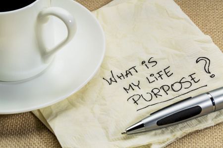 What is my life purpose question on a cocktail napkin with a cup of coffeeの写真素材