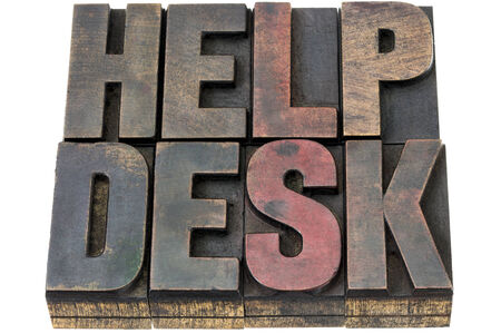 help desk - isolated words in vintage letterpress wood type with ink patinaの写真素材