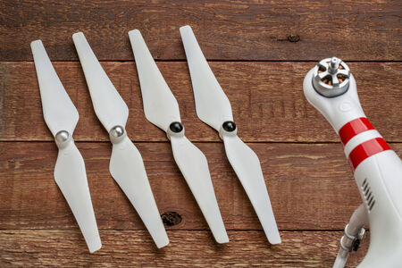 a set of plastic, flexible propellers for a small drone (quadcopter) with a one drone arm out of...