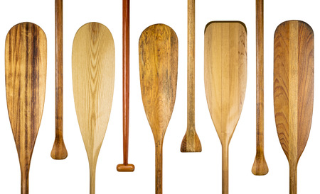 blades and grips of  wooden canoe paddles, a variety of styles and shapes - paddling conceptの写真素材