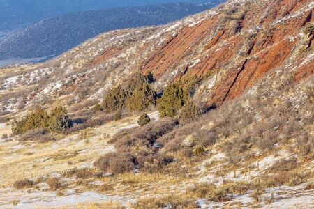 layers of red sandstone rock - winter scenery in Red Mountain Open Space near Fort Collins, Coloradoの写真素材