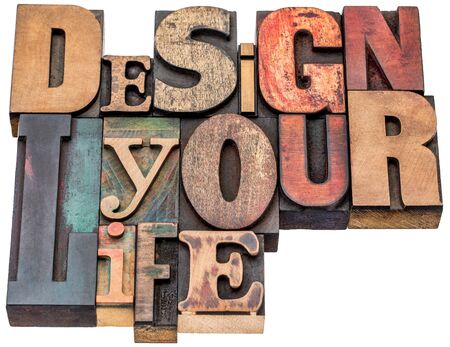 design your life - motivational advice - isolated word abstract in mixed vintage letterpress printing blocksの写真素材