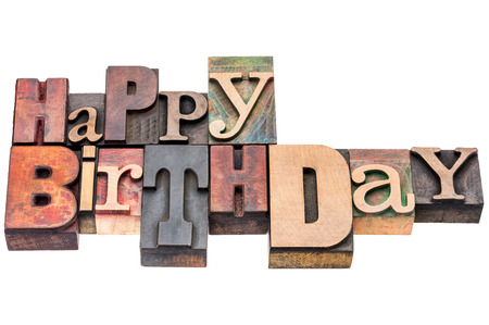 Happy Birthday sign or greeting card - isolated text in vintage mixed letterpress wood typeの写真素材