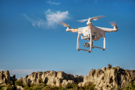 CARR, CO, USA, SEPTEMBER 14, 2015:  Radio controlled Phantom 3 quadcopter drone is flying with a...