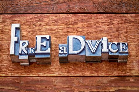free advise word abstract in letterpress metal type against rustic barn wood
