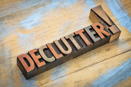 declutter exclamation - word in vintage letterpress wood type printing blocks stained by color inksの写真素材