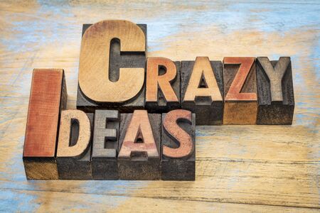 crazy ideas words in vintage letterpress wood type printing blocks stained by color inksの写真素材