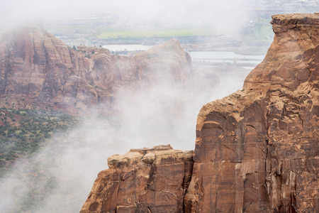 sandstone formations in fog in Colorado National Monument, early spring sceneryの写真素材