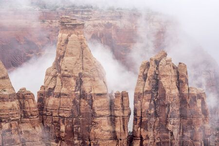 sandstone formations in fog in Colorado National Monument, Coloradoの写真素材